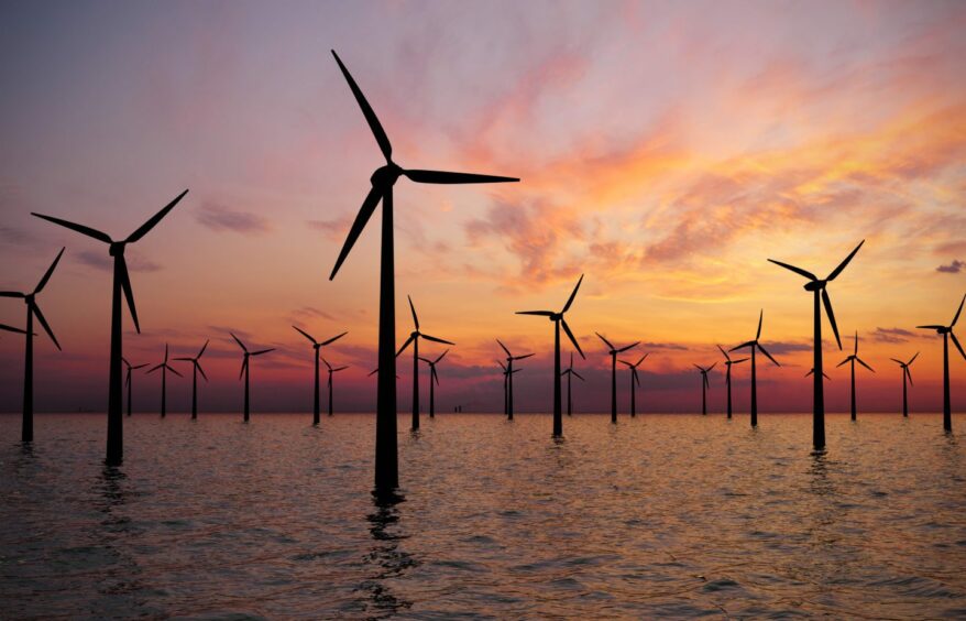 Offshore wind farm at sunset.