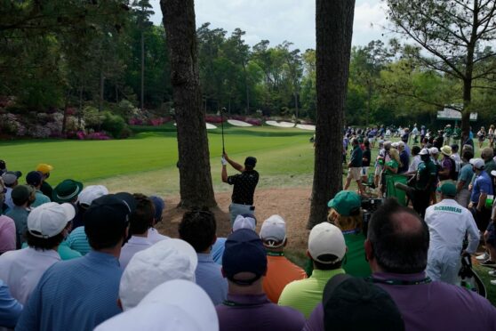 Mandatory Credit: Photo by Charlie Riedel/AP/Shutterstock (11852470dk)
Bryson DeChambeau hits from the trees on the 13th hole during the third round of the Masters golf tournament, in Augusta, Ga
Masters Golf, Augusta, United States - 10 Apr 2021