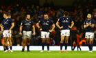 Dejected Scots at the end of the last year's game in Cardiff.