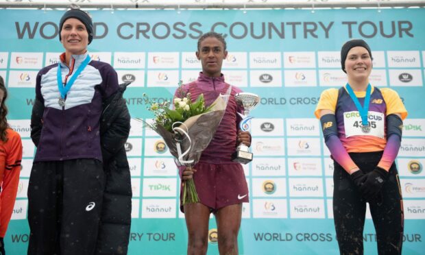 Left to right, Sweden's Sarah Lahti, Eritrea's Rahel Daniel and Great Britain's Megan Keith celebrate on the podium of the women's long race at the CrossCup cross country running athletics event in Roeselare, Belgium, last month. Image: Shutterstock