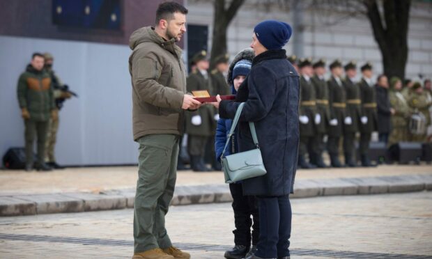 Ukrainian President Volodymyr Zelensky honours relatives of fallen servicemen with the State Award on Sofiivska Square in Kyiv. Image: Presidential press service EPA-EFE/Shutterstock.