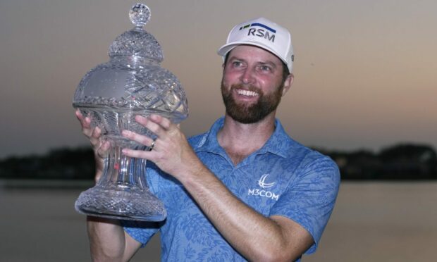 Chris Kirk holds the trophy after winning the Honda Classic on Sunday. Image: Shutterstock