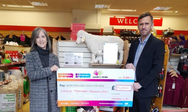 Michelle Ferguson, Cash for Kids charity manager, with Chris Baxter, managing director for Harbro Ltd.
