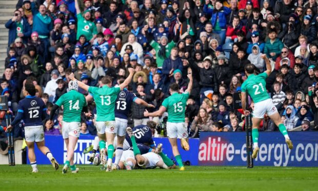 Ireland's players celebrate as Jack Conan of Ireland scores their third try of the match against Scotland. Image: Shutterstock