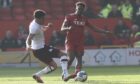 James Hill (72) of Hearts fouls Luis 'Duk' Lopes (11) of Aberdeen on Saturday at Pittodrie. Image: Shutterstock