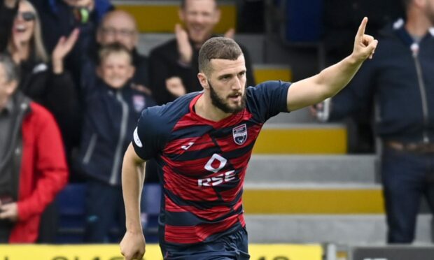 Alex Iacovitti celebrates scoring for Ross County against Celtic last season. Image: SNS