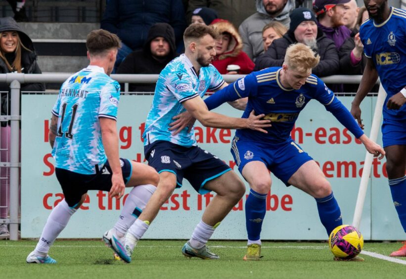 Cove Rangers' Luis Longstaff holds off Ryan Clampin. Image: SNS