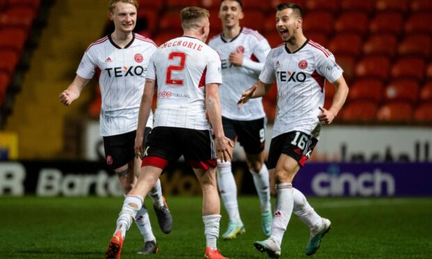 Aberdeen's Ross McCrorie celebrates with Ylber Ramadani after scoring to make it 2-1 against Dundee United. Image: SNS