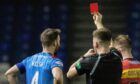 Sean Welsh is shown a red card by referee Grant Irvine. Image: SNS