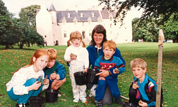 Head gardener Diana Morrison with her young bulbplanting assistants, from left, Susanne Anderson, 7, David Cumming, 5, Mhairi Shanks, 2, Tom Cumming, 3, and Niall Shanks, 5.