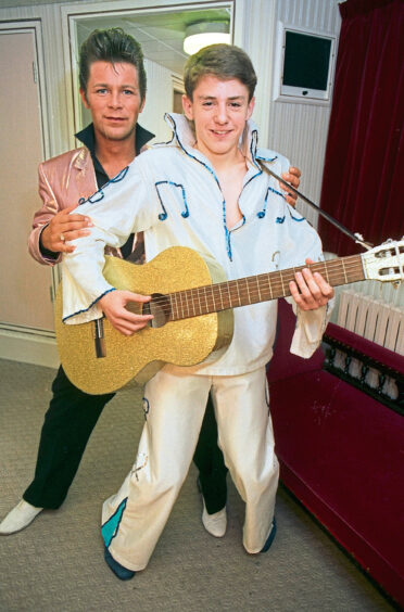 A scout dressed as Elvis for Aberdeen Gang Show along with an actor who is also dressed as elvis for a separate production.