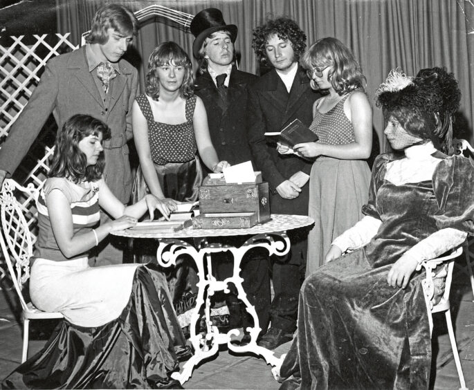 1978 - Dress rehearsal of Oscar Wilde’s The Importance of Being Earnest, by members of the Aberdeen College of Education Drama Group. In the scene, from left, are Shonagh McDonald (sitting), Graham Sangster, Sandra Morris, John Struthers, Chris Begg, Norma Davidson and Barbara Weir.