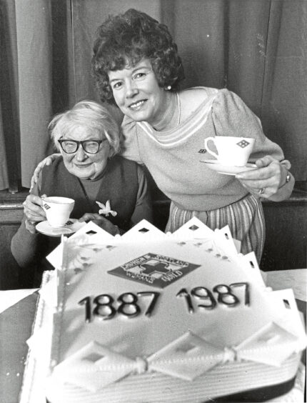 1987 - Queen’s Cross Church Women’s Guild president Ruth Sturgeon and Nora Davidson, 90, celebrate the centenary.