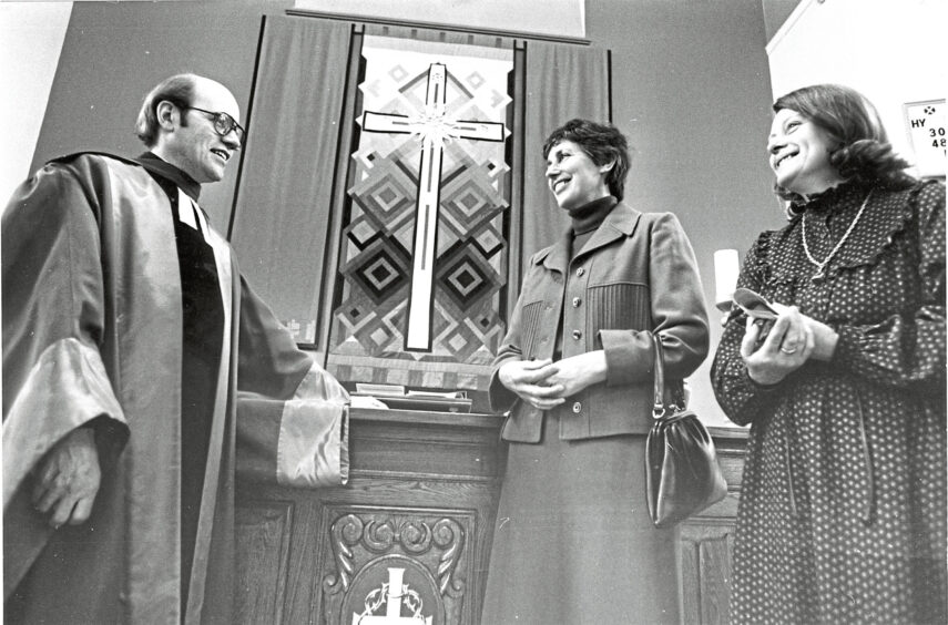 1980 - Admiring a wall hanging are the Rev Edmund Jones, Sheila Kelly and Roma Fraser.