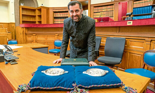 Humza Yousaf with the Great Seal of Scotland after being sworn in as First Minister of Scotland at the Court of Session, Edinburgh. Image: Jane Barlow/PA Wire