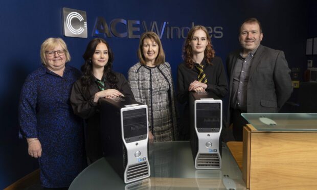 Ace Winches has donated 33 computers to Turriff Academy. Jane Bisset, Turriff Academy deputy head, pupil Lauren Ratter, Valerie Cheyne, Ace Winches chief compliance officer, pupil Emily Robinson and Scott Hunter, Turriff Academy head of technology. Image: Fifth Ring