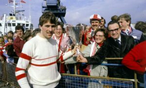 Mark McGhee shows the European Cup-Winners Cup to fans from the St Clair when it docked in Aberdeen.
ABERDEEN JOURNALS Ltd.  13.5.1983.
