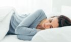 Woman getting a good night's sleep naturally