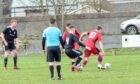 Inverness Athletic's two-goal star Ryan MacLeod holds off Thurso defence as he looks to pass to Sam Irving out wide in his team's 2-1 weekend win. Image: Courtesy of Inverness Athletic FC