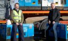 Darren Thomson, from Springfield Properties, and Alastair Stewart, trustee of Pick-Ups for Peace, with the generators. Image: Springfield Properties.
