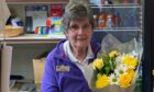 Doreen Aldridge received an award and some flowers to celebrate her 40 years of service. Image: Post Office.