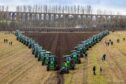 FABULOUS FURROWS: The spectacular sight of the massed tractors at the Field of Deere speed ploughing event has gone viral, with millions of views on TikTok and YouTube. Pictures by Anne MacPherson and Andrew Stevenson.