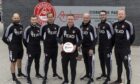 Barry Robson, centre, with his backroom staff after being named Premiership manager of the month for March. Image: 3x1