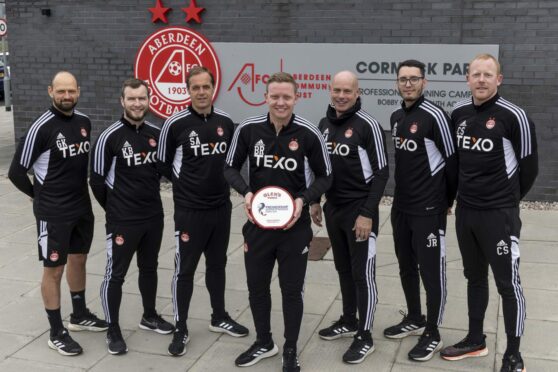 Barry Robson, centre, with his backroom staff after being named Premiership manager of the month for March. Image: 3x1