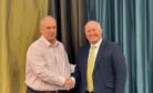 Paul Johnson, managing director of Barenburg UK, left, shaking hands with Johnny Watson of Watson Seeds.