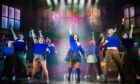 Jenna Innes centre stage as Veronica during a UK tour performance of Heathers The Musical.