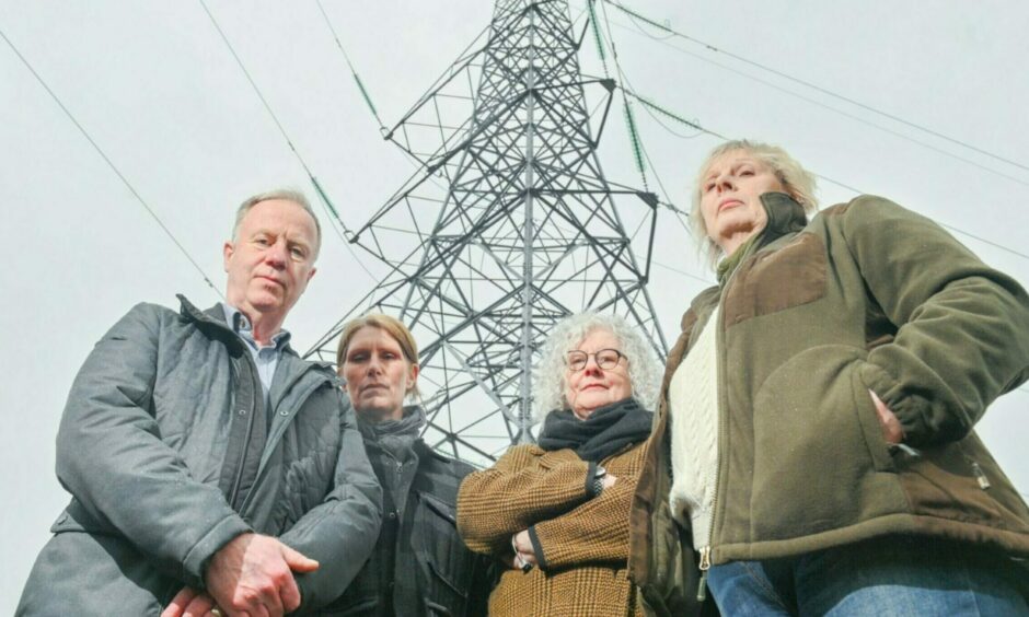 Four campaigners who are trying to stop new power lines around Beauly.