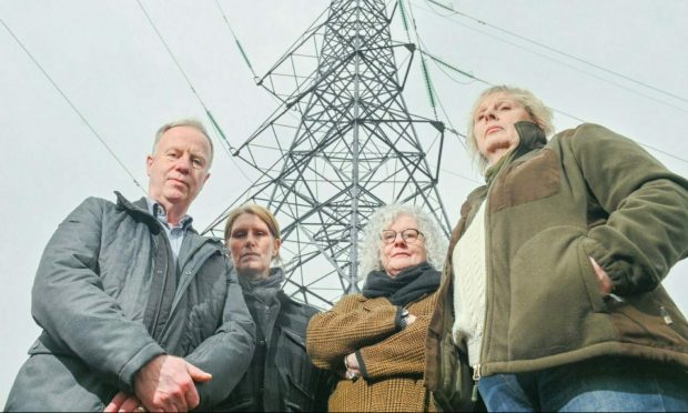 The campaign group Community B4 Power Companies was set up to fight power line plans.  Lyndsey Ward is on the far right. Image Jason Hedges/DC Thomson