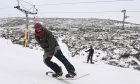 Man snowboarding at Cairngorm Mountain