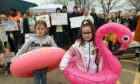 Campaigners fighting the closure of Bucksburn swimming pool gathered outside the pool holding placards and wearing rubber rings and armbands. Picture of (L-R) Nell McDonald, five, and Paige Dalgleish, six. Image: Kenny Elrick/DC Thomson