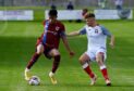 Luke Emmett, left, in action for Keith. Image: Kenny Elrick/DC Thomson