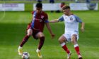 Luke Emmett, left, in action for Keith. Image: Kenny Elrick/DC Thomson