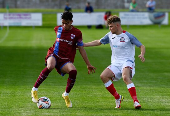 Luke Emmett, left, in action for Keith. Image: Kenny Elrick/DC Thomson