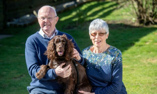 George Annand at home with his wife Julie and dog Poppy. Image: Kath Flannery/DC Thomson