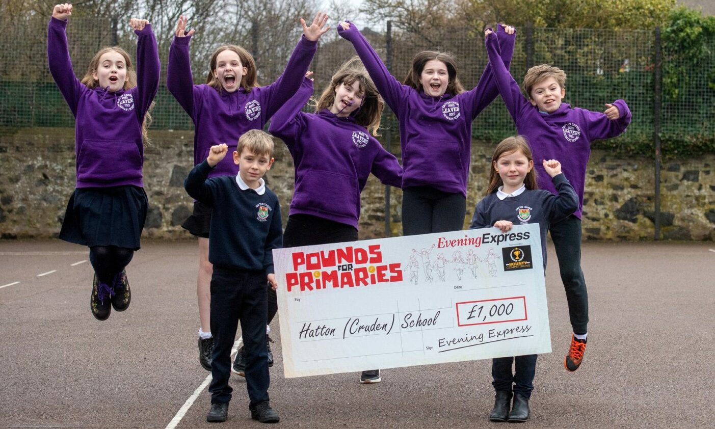 Pounds for Primaries winners from Hatton (Cruden) school jump for joy with their £1,000 cheque.