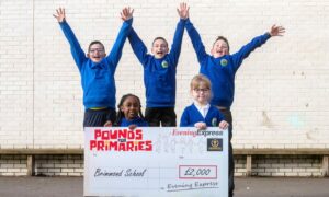 Amya Shonge, Jessica Gordon, Aiden Greig, Max Carle and Archie Scott from Brimmond School in Aberdeen jump for joy after receiving £2,000 from the Evening Express Pounds for Primaries project. Image: Kath Flannery/DC Thomson