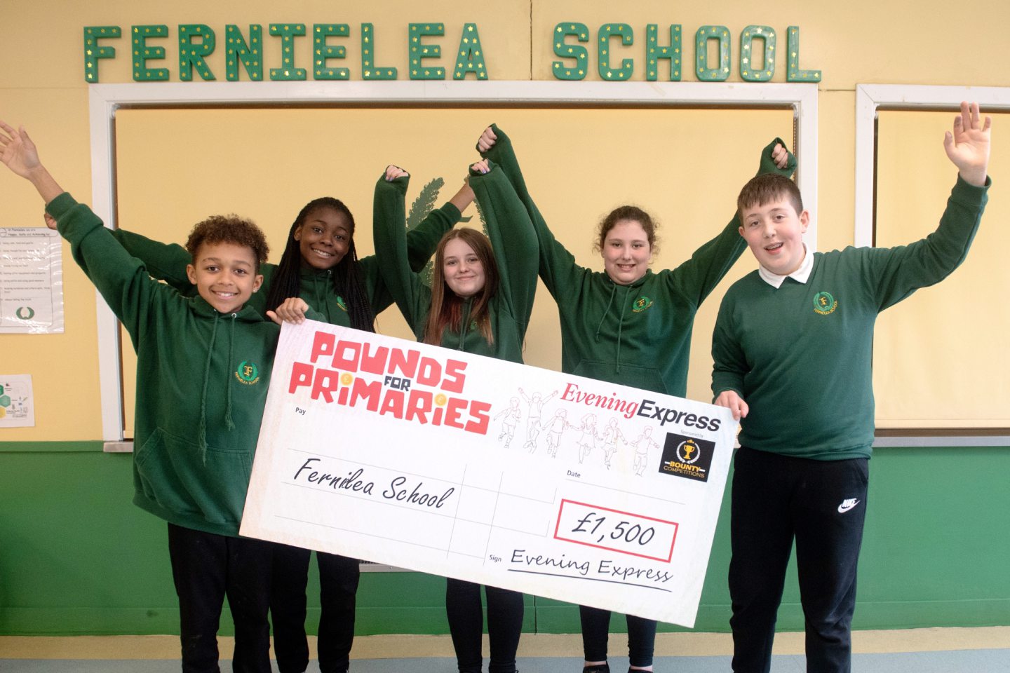Pounds for Primaries winners Theo Omoniyi, left, Fiyin Ayansina, Charley Mackie, Kylah Ewan and Ethan Fleming from Fernielea School and their big cheque.