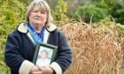 Sandra Geddes with a picture of her brother Alan Geddes.