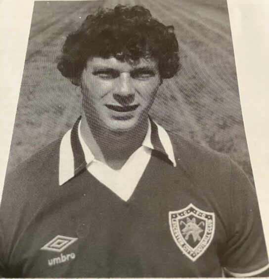 Black and white, head and shoulders photo of Kevin Macdonald