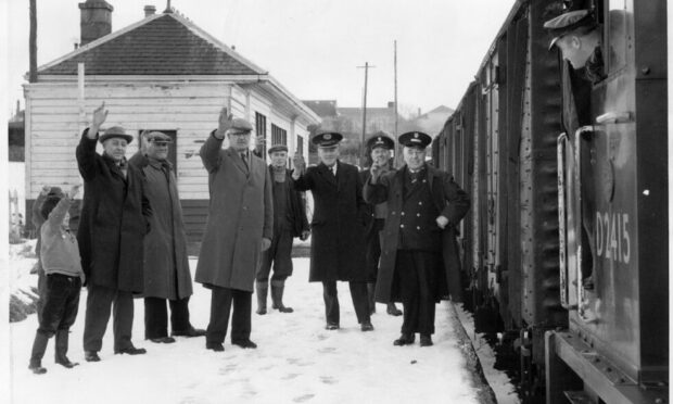 Waving off the last train at Meldrum station on December 30 1965, with driver Nicky Littlejohn of Inverurie. Image: DC Thomson