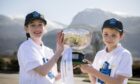 Freya and Fraser of Lochaber School made the draw for the Cottages.com MacTavish Cup 2023. Image: Camanachd Association
