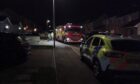 Police cars and the fire service were at the scene of the incident. Image: Cameron Roy.