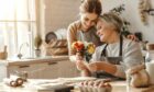 Mother and daughter in kitchen.