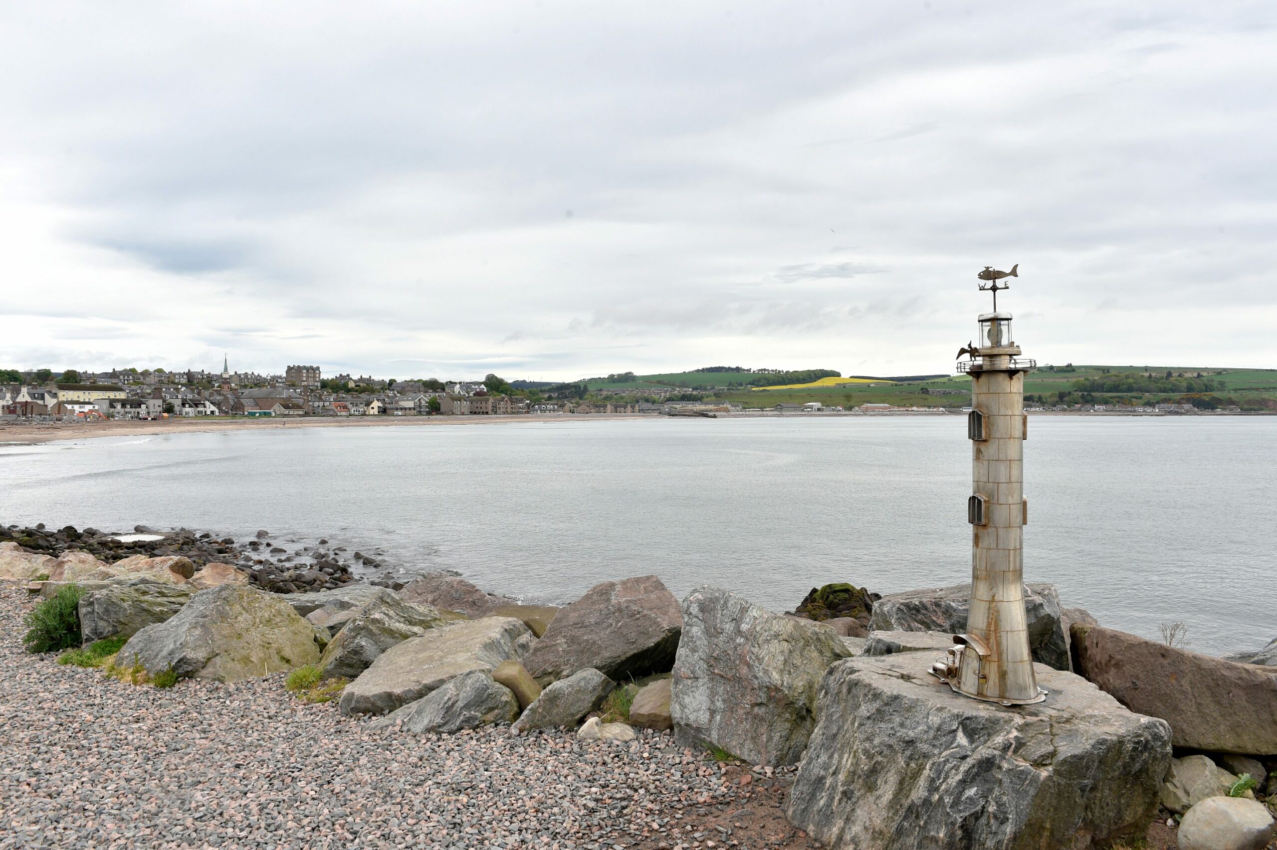 A steel sculpture of a lighthouse at Stonehaven beach