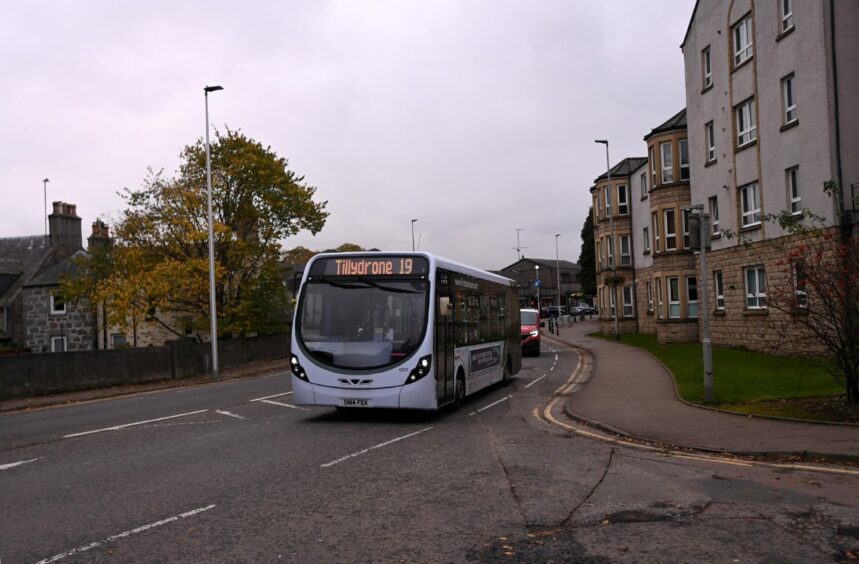 The Number 19 bus travelling along the A93 through Cults