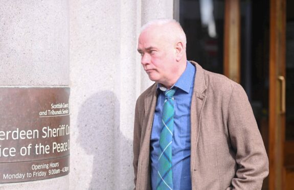Douglas Boal admitted stalking his co-worker at Aberdeen Sheriff Court. Photo of Douglas outside court. Image: DC Thomson